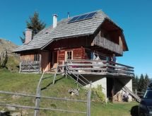 Vrijstaande Harterhütte met sauna aan de golfbaan in Klippitztörl - thumbnail 1