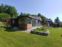 Vrijstaand chalet in Les Prés-d'Orvin met tuin, open haard en Jura-uitzicht - thumbnail 2