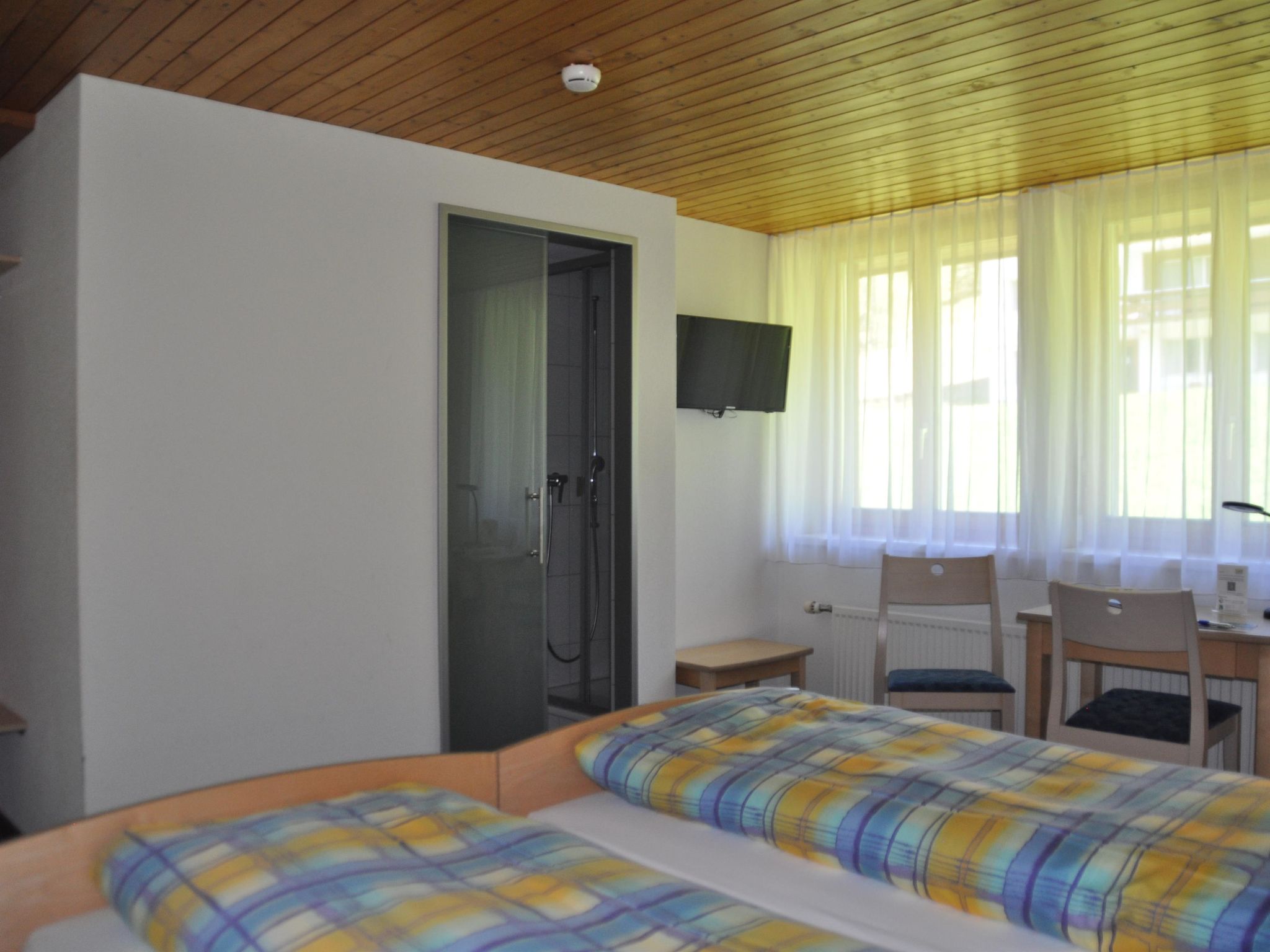 Ferien- und Familienhotel Alpina Doppelzimmer, Dusche, WC, Standard - Drinnen