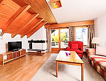 Centraal appartement in Montana, 300m van skilift & 450m van meer - thumbnail 1