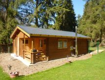 Holz-Blockhaus für vier Personen mit Terrasse