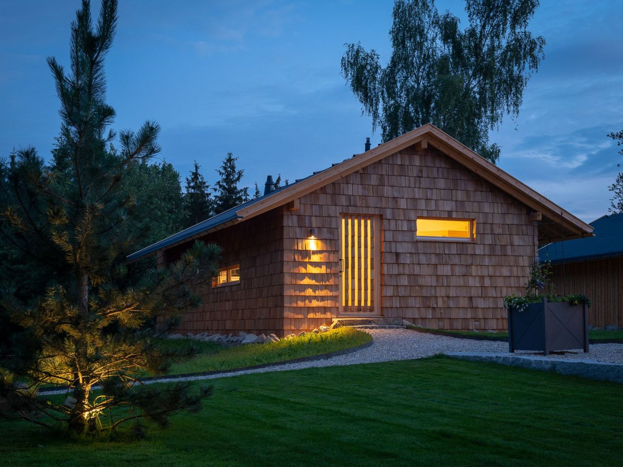 SPACE FOR VALUABLE TIME Simple and clear - on the outside, in the tradition of shelters for people who have called the forest home for centuries and used it to earn a living - regionally localised - w..