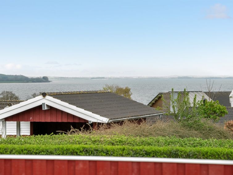 Open haard en sauna in vakantiehuis Henrijette aan zee in Sjølund in Sjølund