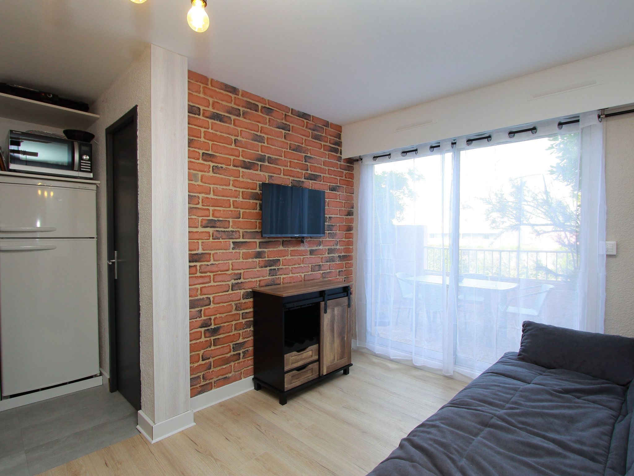 Photo of Gartengeschoss in der Nähe von Strand und Hafen