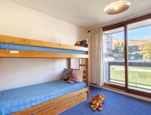 Appartement direct aan de piste met verwarmd zwembad in Le Corbier - thumbnail 4