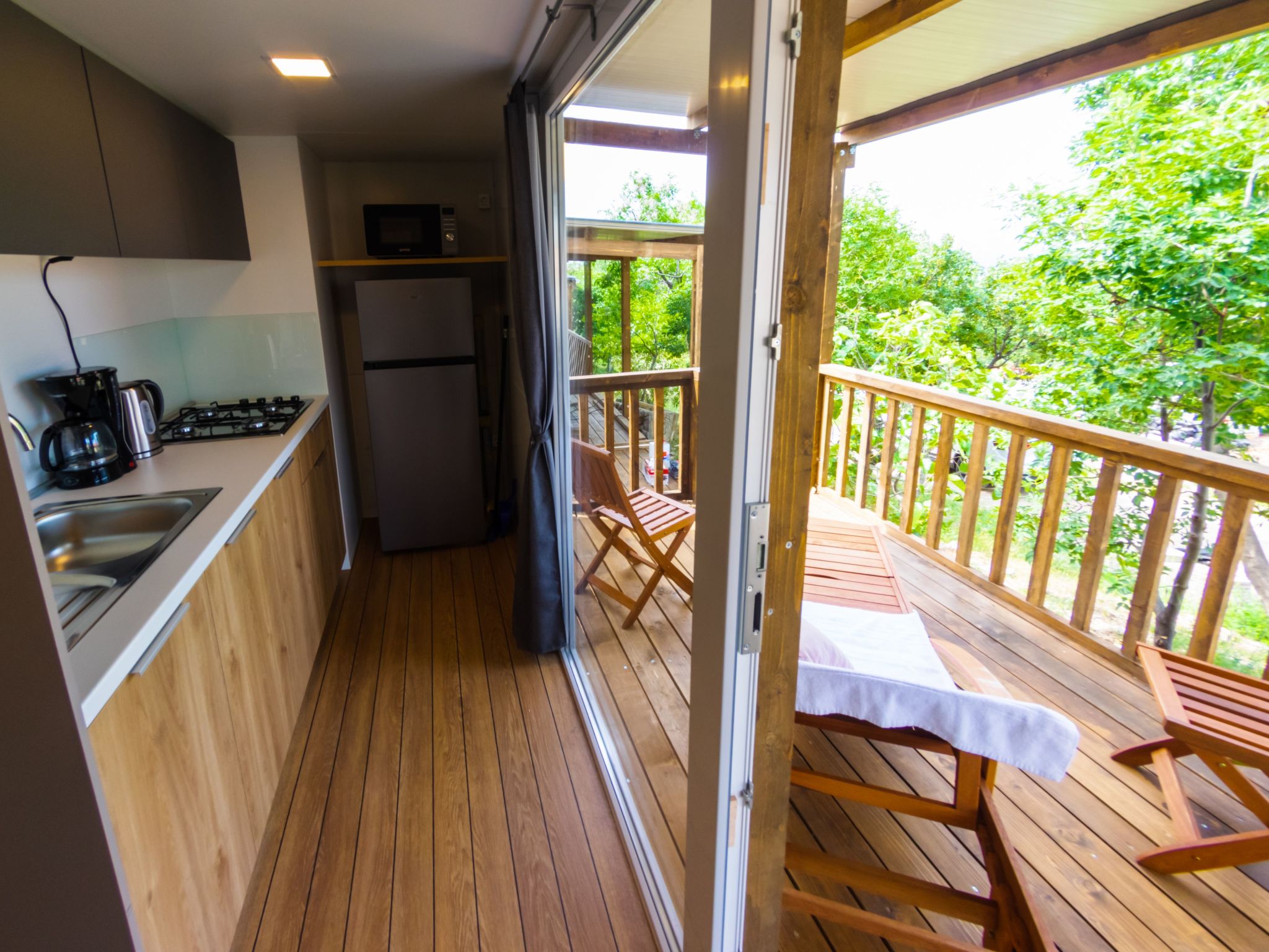 Mobilheim mit gemeinschaftlichem Pool-Dedans