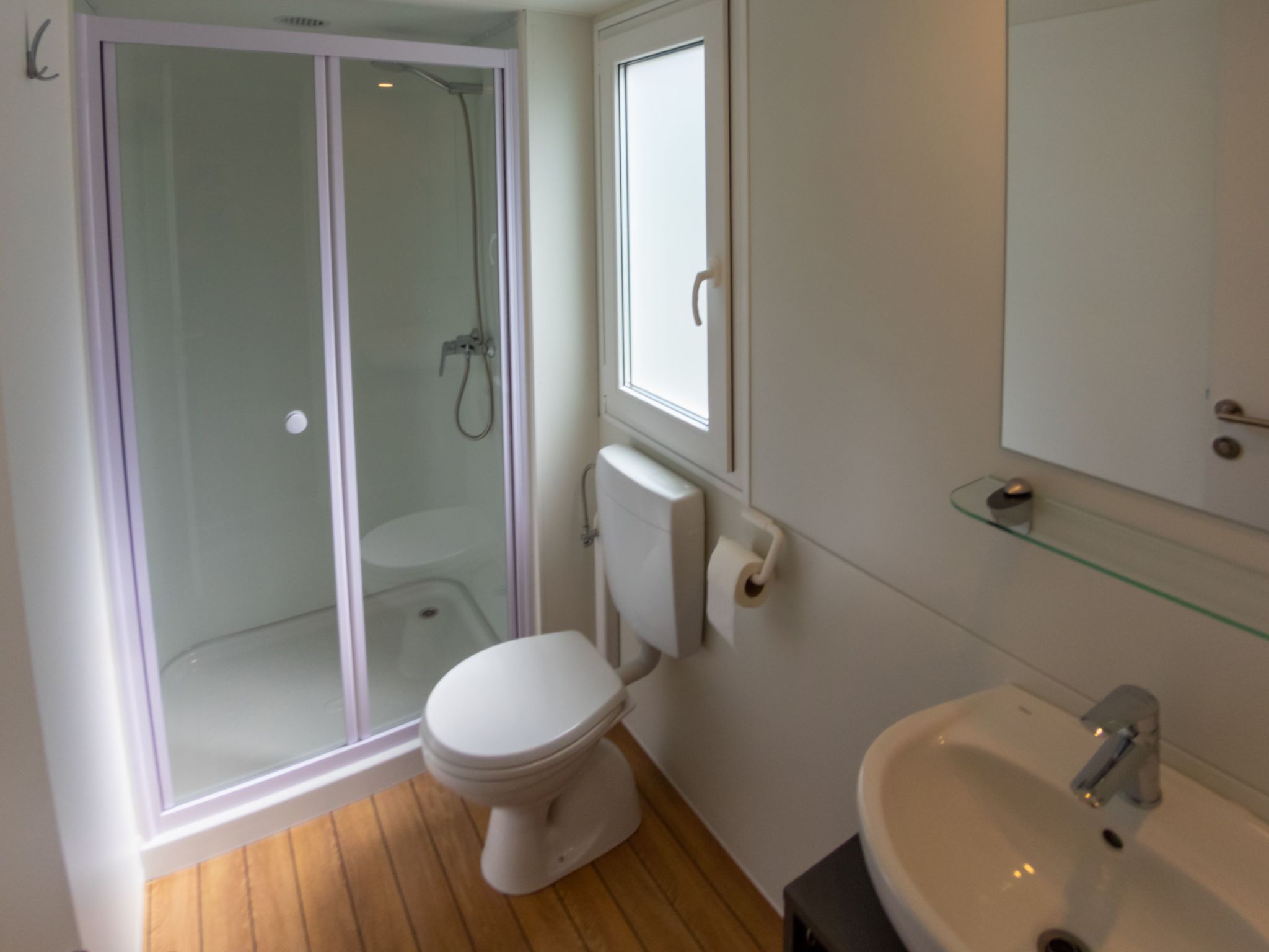 Mobilheim mit gemeinschaftlichem Pool-Dedans