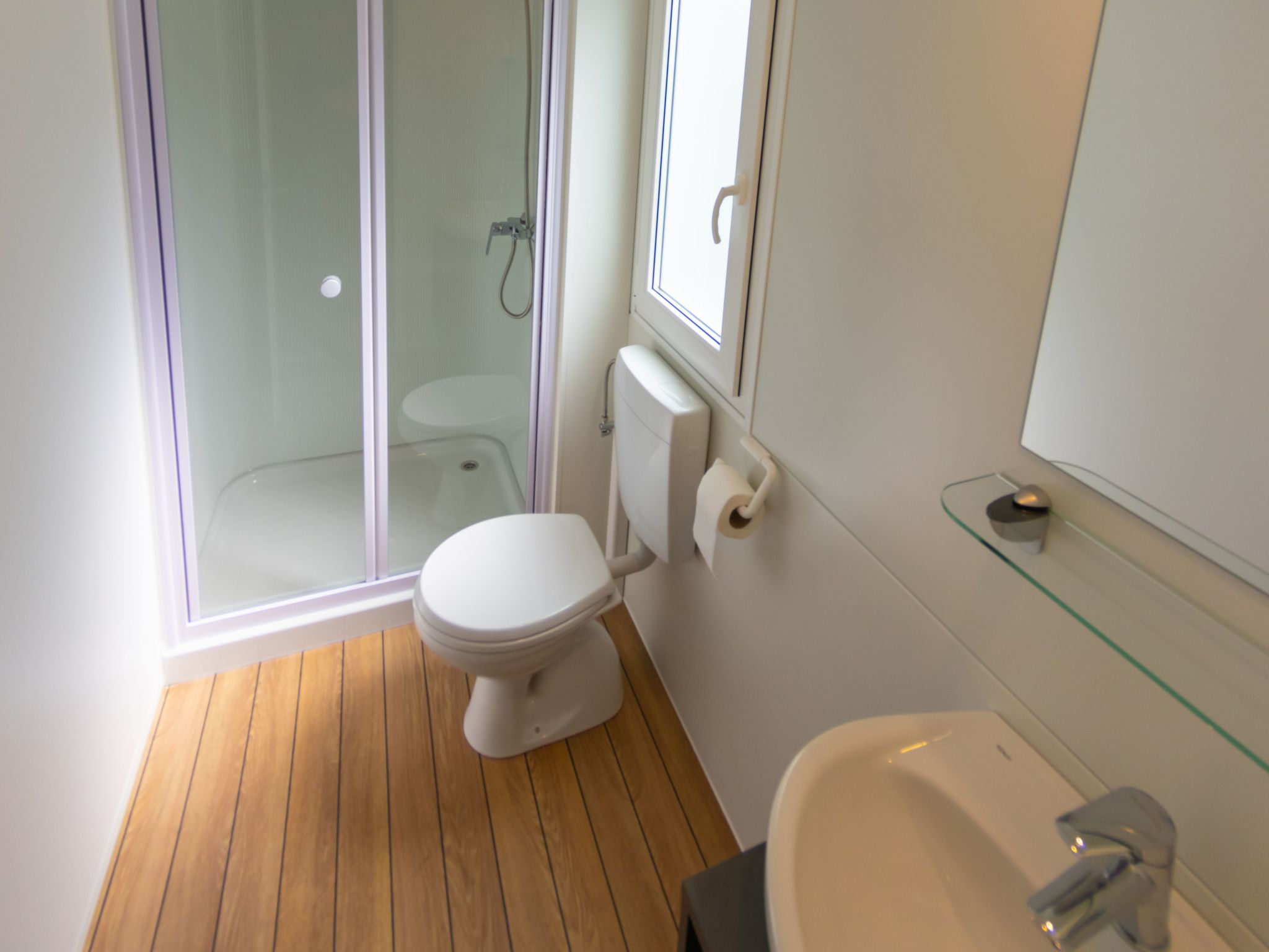 Mobilheim mit gemeinschaftlichem Pool-Dedans