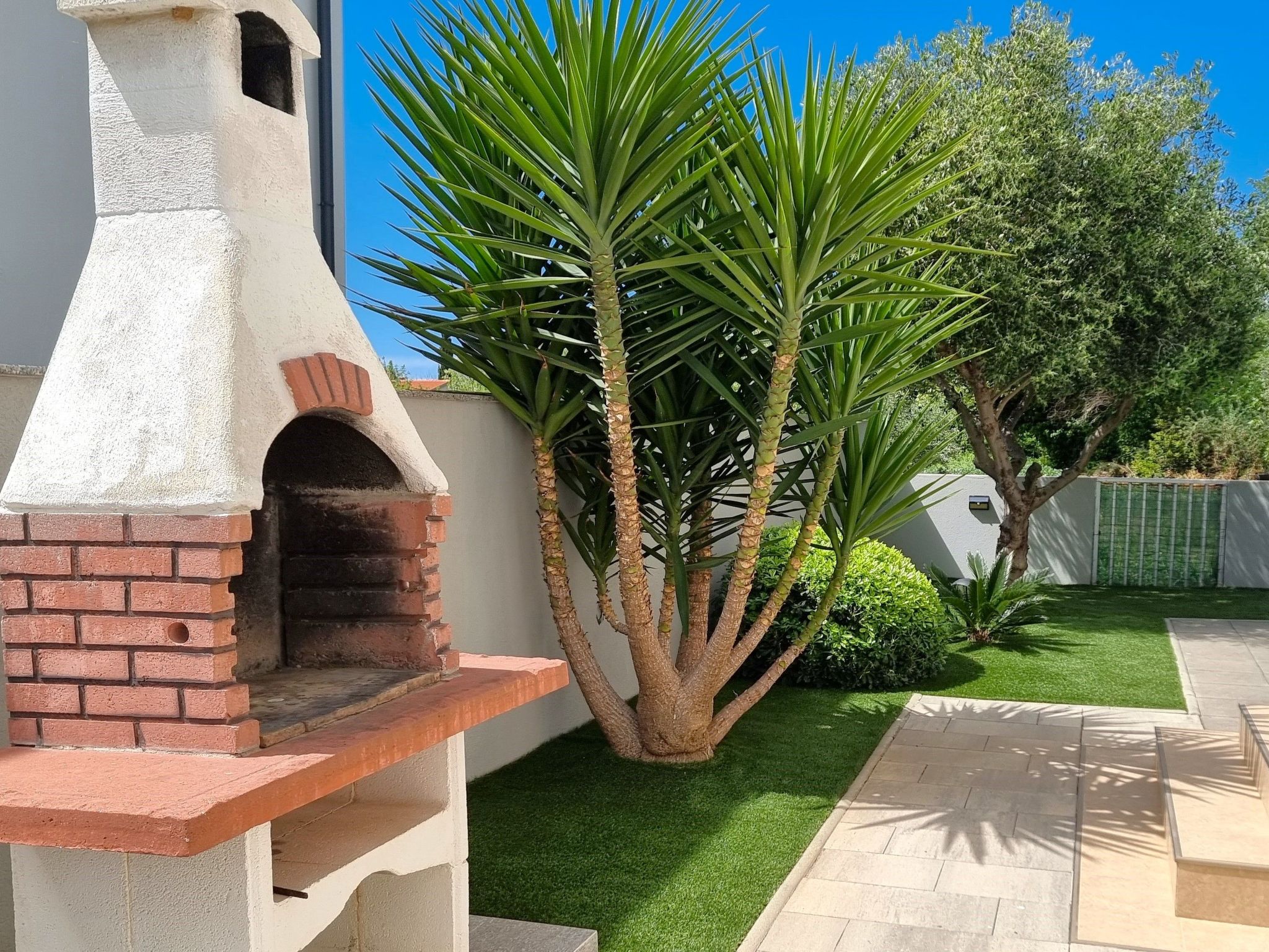 Erdgeschoss-Ferienwohnung mit Garten und Pool-Dedans