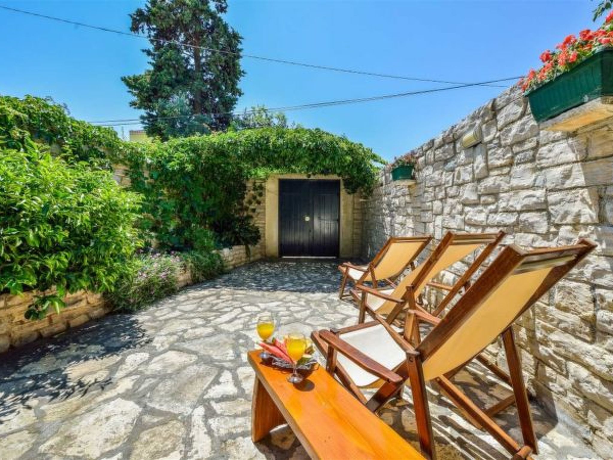 Photo of Stone Holiday house Zara with jacuzzi