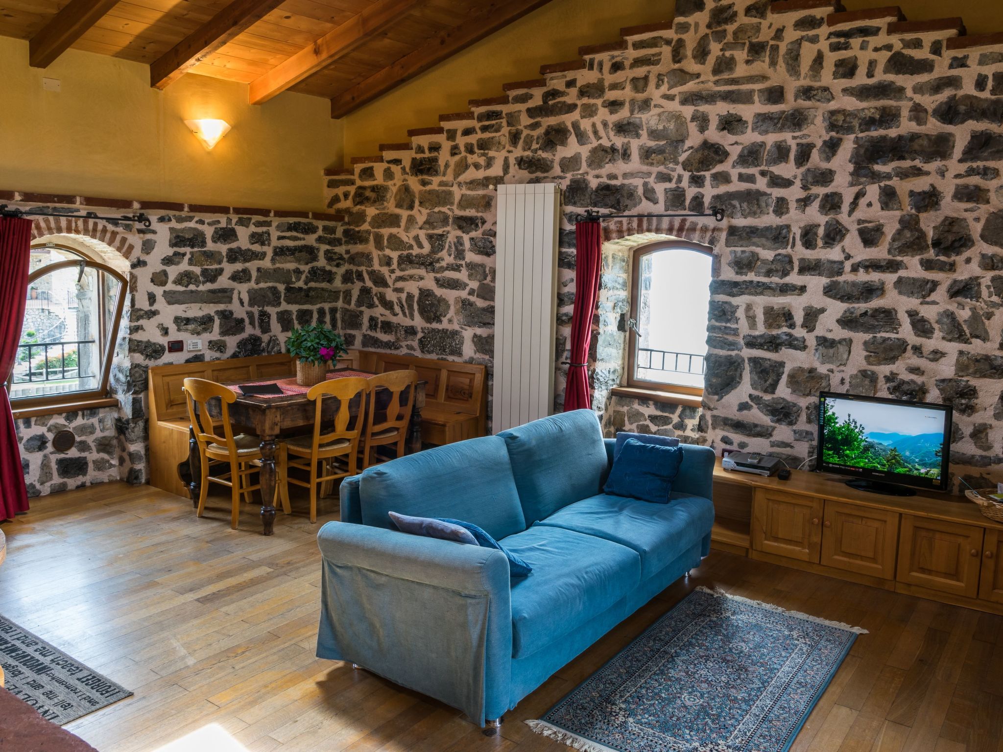 The apartment is located on the top floor of the Zorzino castle tower and can accommodate up to six people. Thanks to the wooden ceiling beams and solid wood furniture, there is a welcoming medieval a..