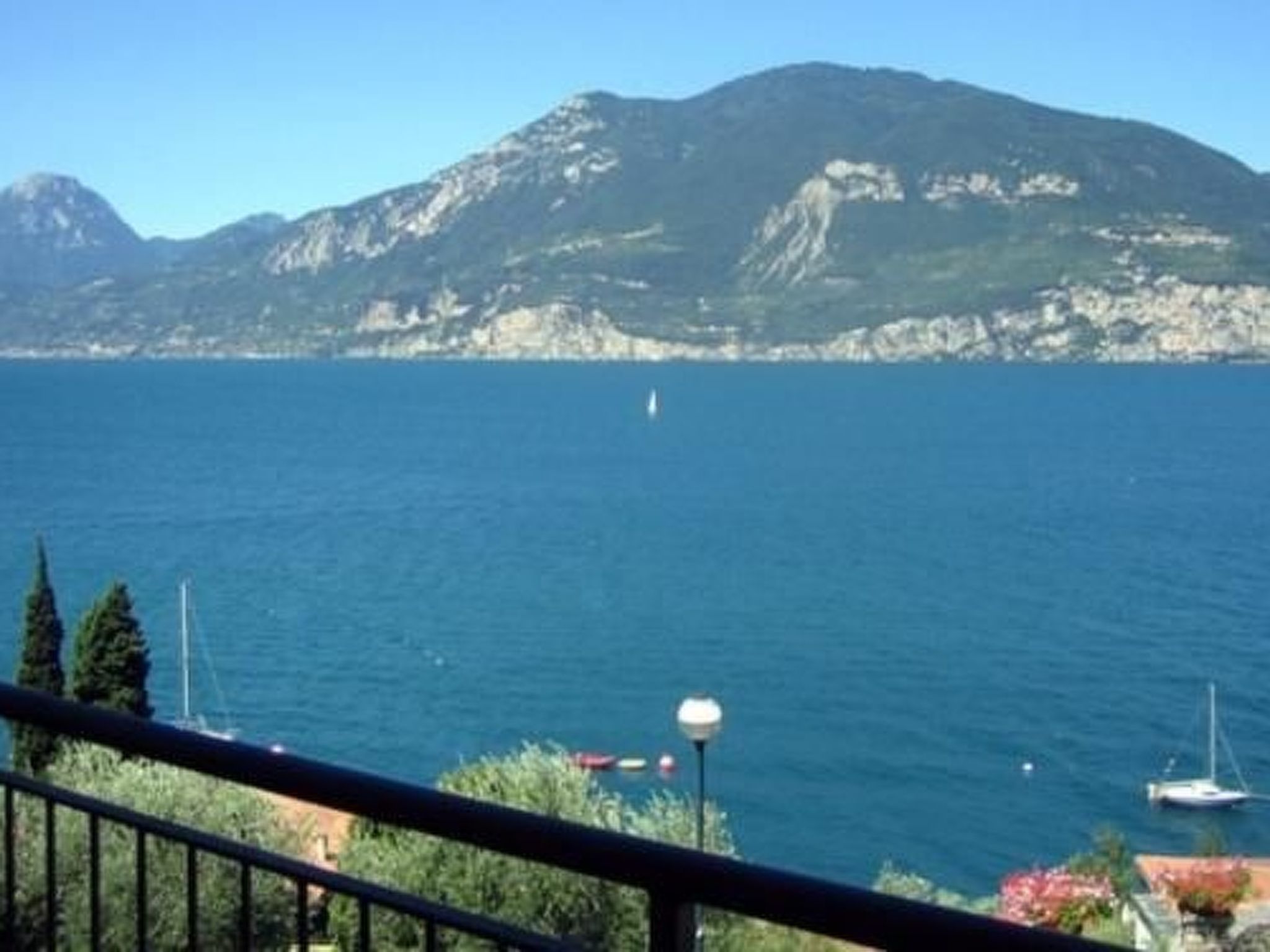 Photo of Wohnung 8 mit Seeblick, Garage, Schwimmbad,