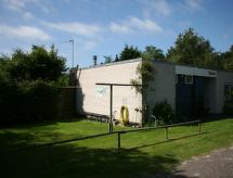 Vrijstaande bungalow met haard en omheinde tuin, 1,5 km van zee, Den Burg - thumbnail 4