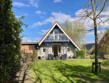 Grachthaus: Vrijstaande bungalow aan het Lauwersmeer met tuin en golfbaan - thumbnail 2